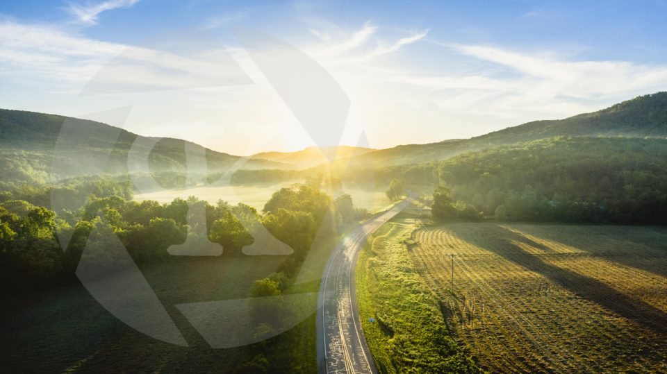 Aerial shot of a road at sunset